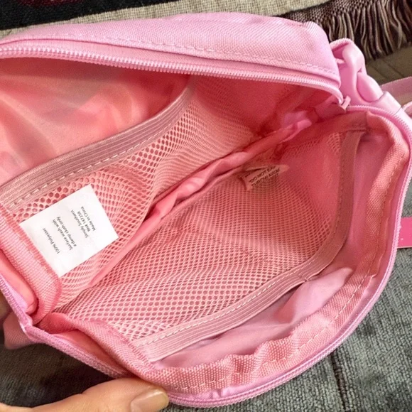 pink canvas crossbody belt bag with striped strap - Picture 4 of 5